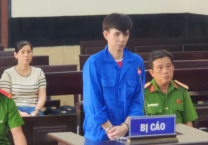 Nguyễn Văn Mình tại tòa. Ảnh: Nam An